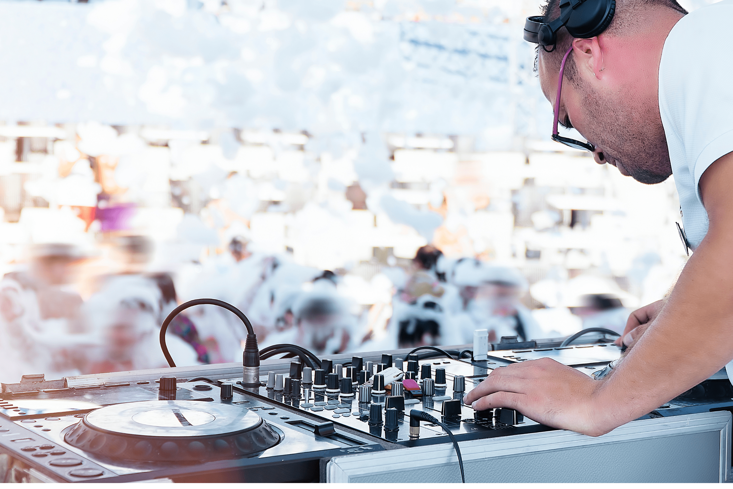 dj playing set a festival in front of audience