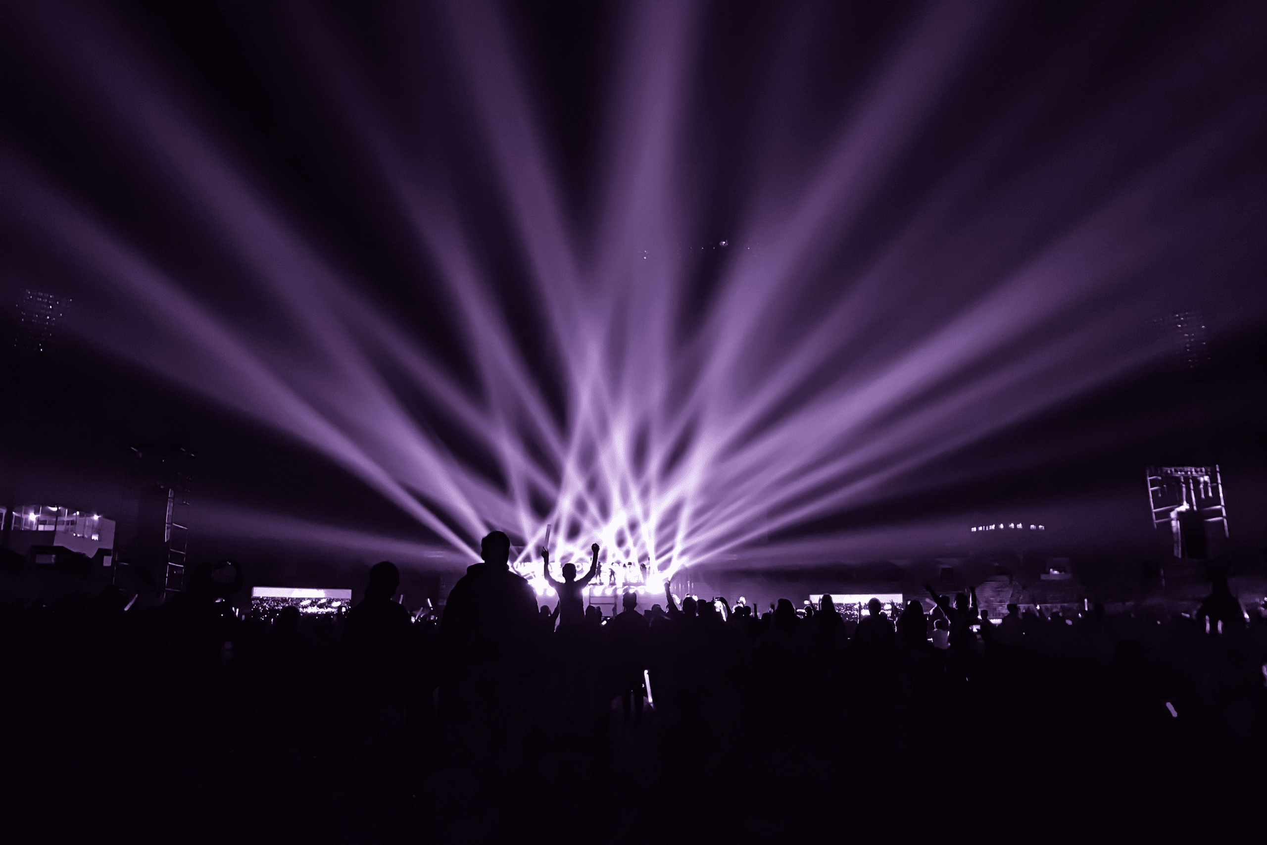 edm music festival purple lights on stage